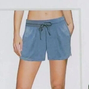 > mineral washed short with rib trimmed pockets. Light blue